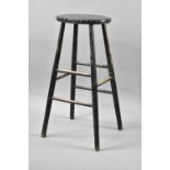 A Vintage Black Painted Stool with Leather Studded Top, 75cms High