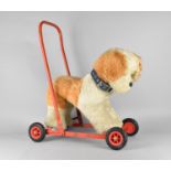 A Vintage Push Along Dog with Steel Frame and Rubber Tyres, 63cms High