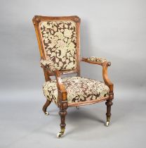 A Late Victorian/Edwardian Ladies Armchair with Tapestry Upholstery on Turned Supports Culminating