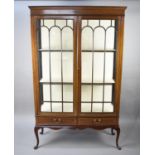 An Edwardian String Inlaid Display Cabinet with Two Base Drawer and Cabriole Supports and Dentil