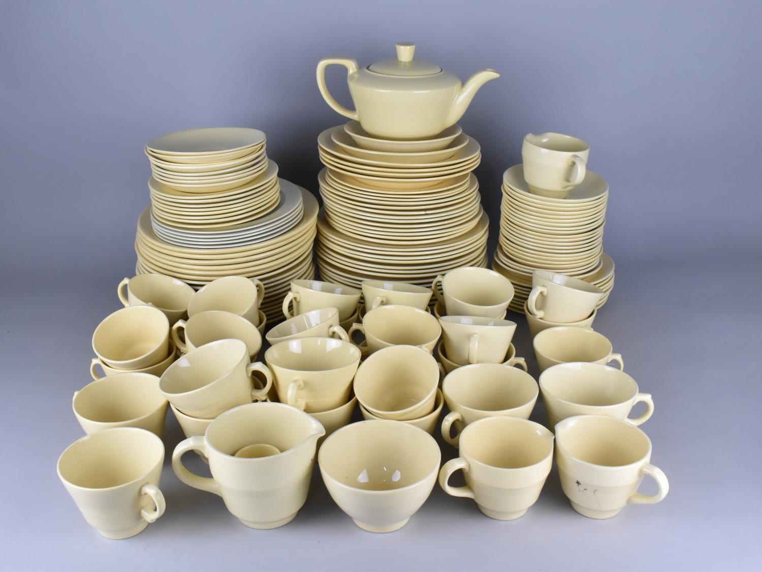 A Large Collection of Wood's Jasmine Yellow Glazed Tea and Dinner Wares