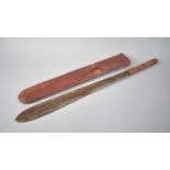 A Vintage Wooden Handled Maasai Simi in Animal Skin Scabbard