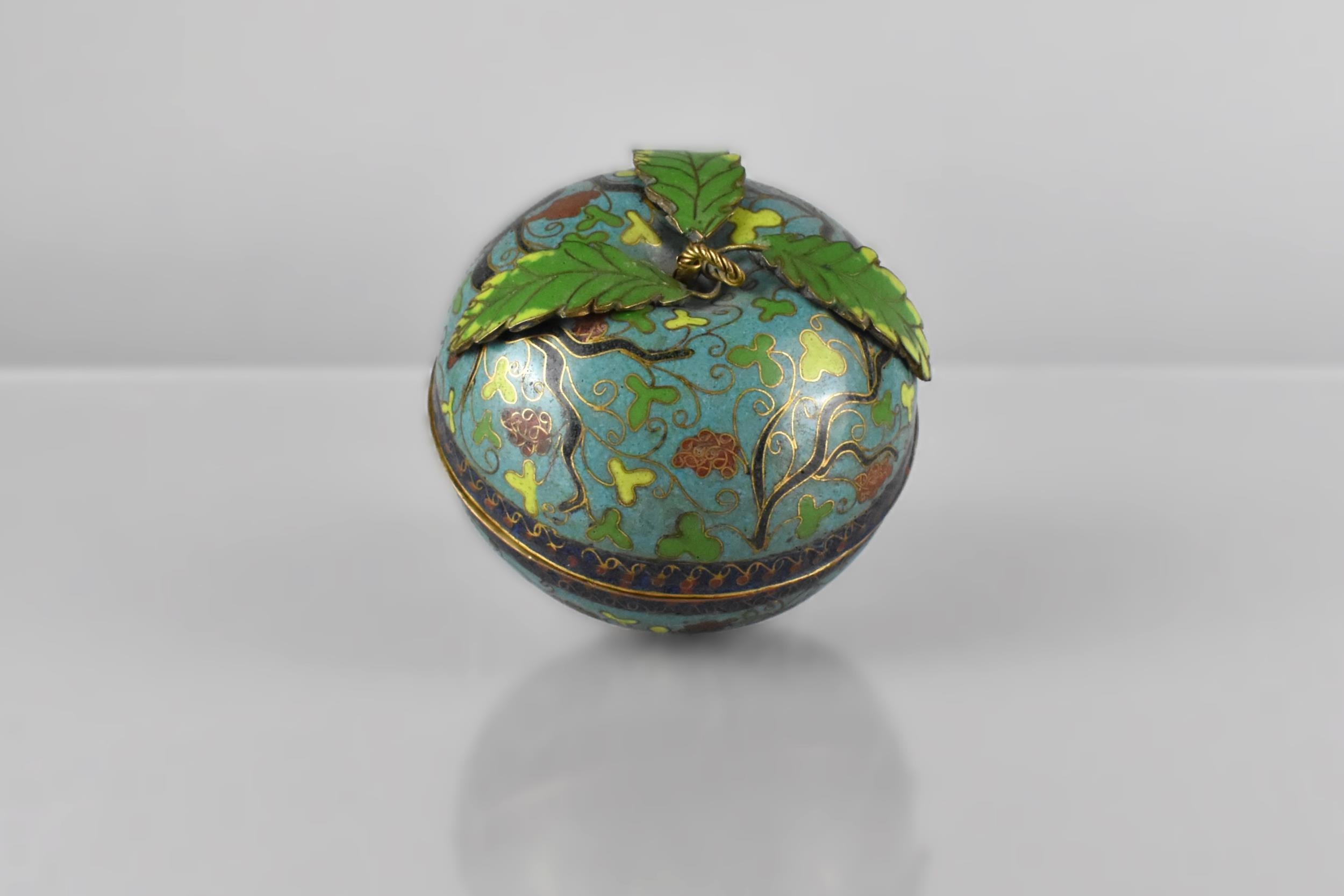 A Chinese Late Qing Dynasty Cloisonne Box in the Form of an Apple Decorated with Grape and Vines
