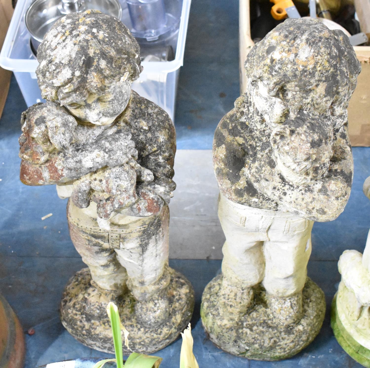 A Pair of Reconstituted Stone Garden Figures Modelled as Standing Children, 69cms High