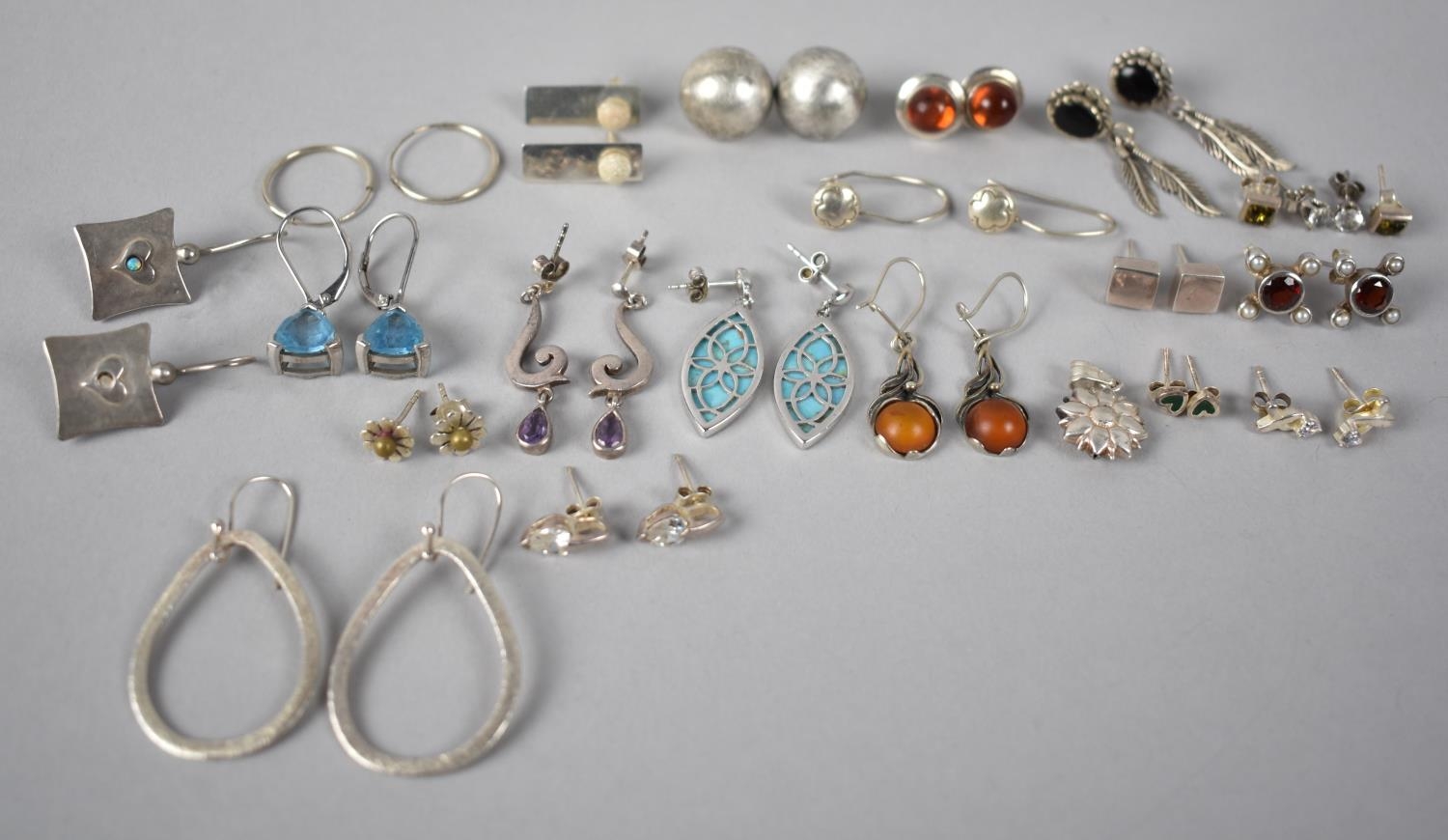 A Large Collection of Various Silver Earrings to include Navajo Style, Amber Mounted, Modernist,