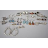 A Large Collection of Various Silver Earrings to include Navajo Style, Amber Mounted, Modernist,