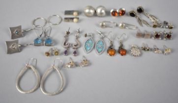 A Large Collection of Various Silver Earrings to include Navajo Style, Amber Mounted, Modernist,