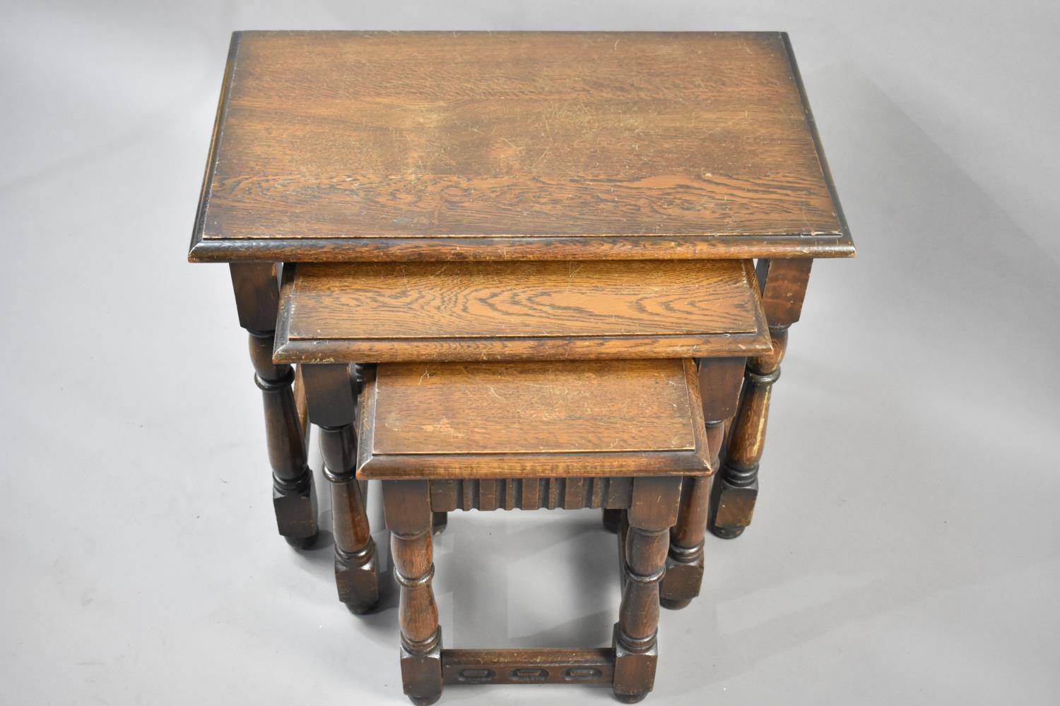 A Mid 20th Century Oak Nest of Three Tables with Turned Supports, Largest Table 61x36.5x47cms High - Image 2 of 2