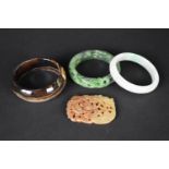 Two Chinese Jade Bangles Together with an Agate Example and a Chinese Carved Amulet