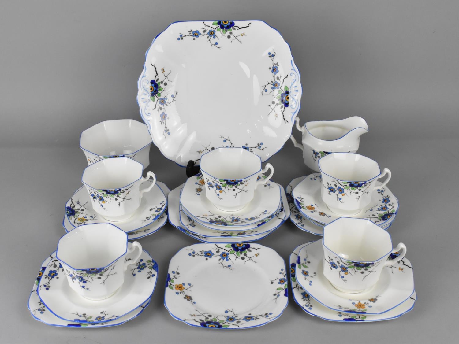 A Hand Painted Fenton Tea Set with Blue Floral Trim to Comprise Five Cups, Six Saucers, Six Side