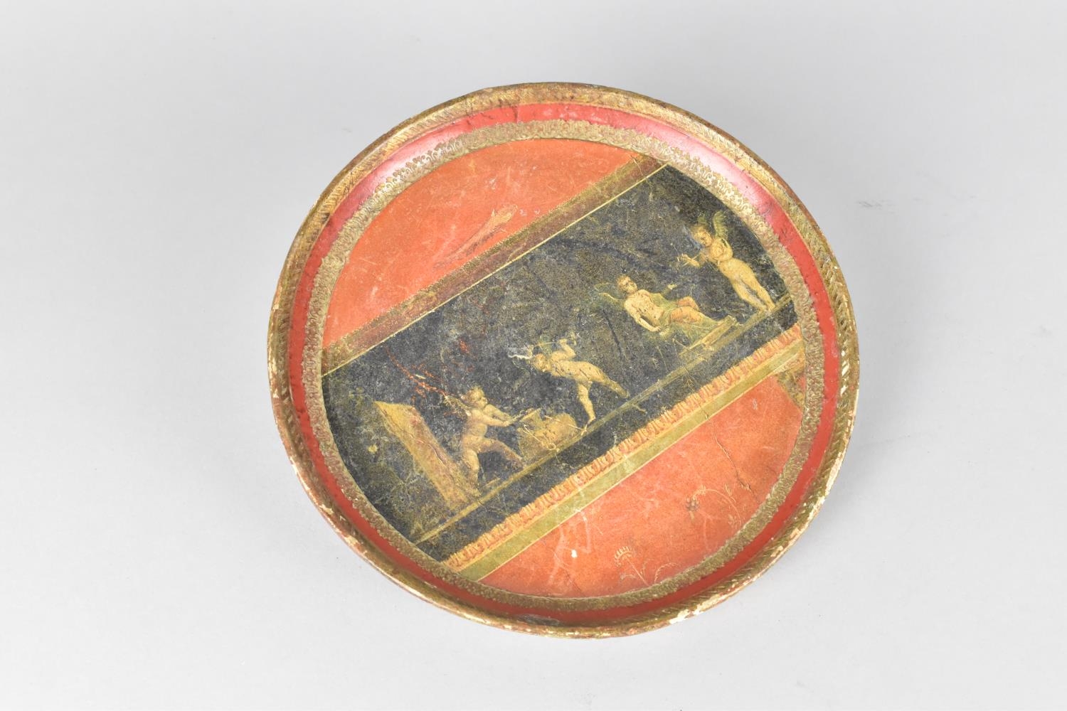 A 19th Century Papier Mache Circular Tray Decorated with Classical Cherub Frieze on Red Ground,