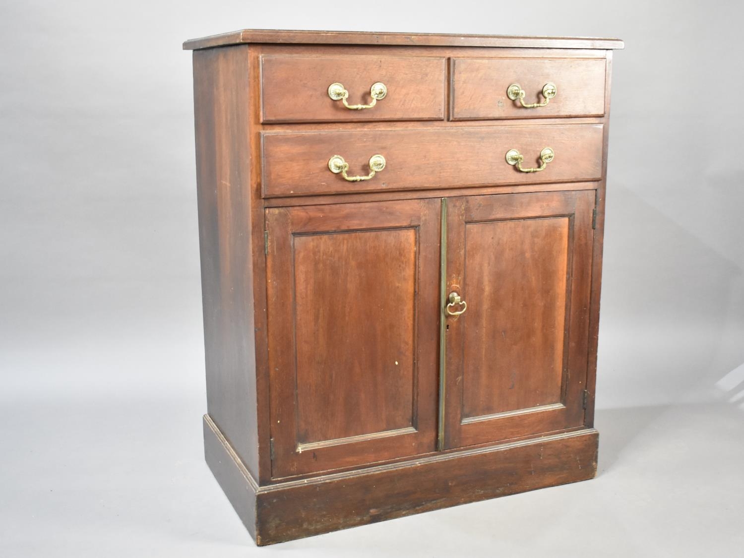 A 19th Century Oak Cabinet with Bottom Cupboard Base Surmounted by One Long and Two Short Drawers