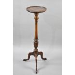 A Mahogany Torchere Stand with Circular Top having Turned Supports Culminating to Reeded Vase Base