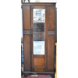 An Edwardian Oak Mirror Fronted Single Wardrobe, 80cms Wide