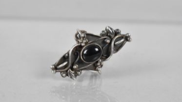 A Large Onyx and Silver Ring in the Southwestern Style, Oval Cabochon Stone on Lozenge Shaped Ground