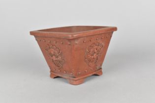 A Chinese Yixing Planter of Square Tapering Form, the Sides Decorated in Relief with Dragon Masks,