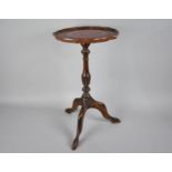 A Modern Mahogany Tripod Wine Table with Tooled Leather Insert, 29cms Diameter