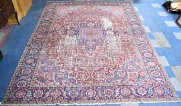 An Early 20th Century Handmade Persian Heriz Pattern Carpet on Red Ground, C.1910, 390x298cm
