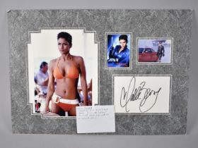 Three Mounted Photographs of Halle Berry together with an Autographed White Card