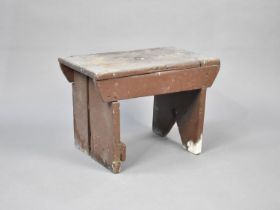 A 19th Century Brown Painted Rustic Stool, 46cms by 27cms and 32cms High