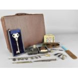 A Vintage Small Leather Effect Case Containing Curios to include Propelling Pencils, Charm Bracelet,