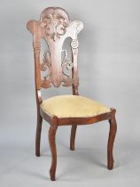A Continental Side Chair with Pierced and Moulded Back, Serpentine Front and Cabriole Front Legs