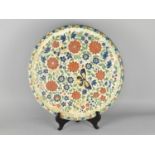 A Large Glazed Pottery Dish Decorated in Polychrome Enamels Detailing Flowers and Butterflies,