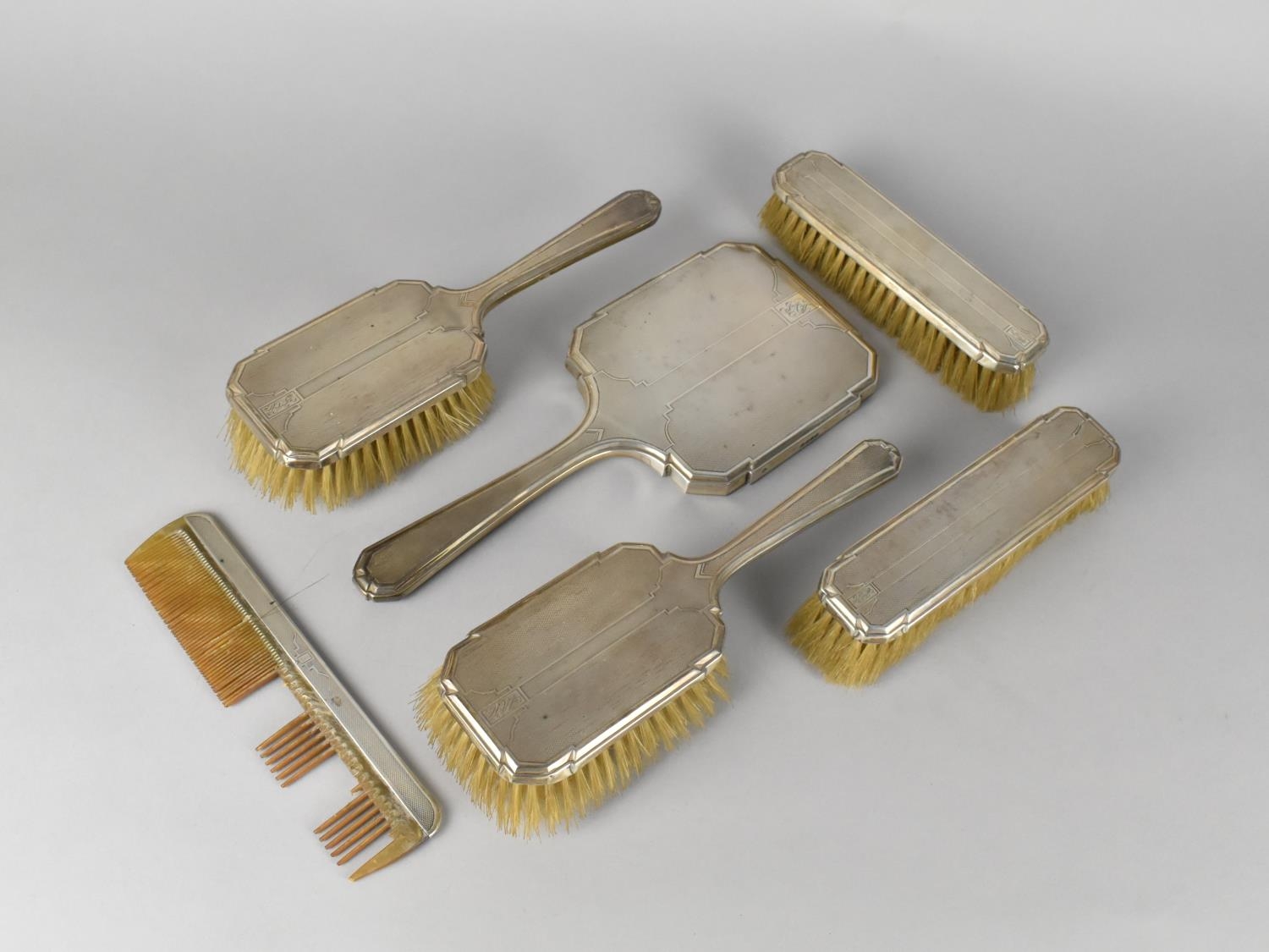 An Art Deco Silver Mounted Dressing Table Set by R.C, London Hallmark 1935 to Comprise Four Brushes,