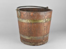 A 19th Century Brass Banded Coopered Oak Bucket with Steel Hoop Handle, 33cms Diameter and 31cms