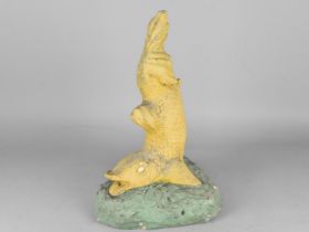 A Reconstituted Stone Garden Ornament Modelled as a Dolphin, 42cm high