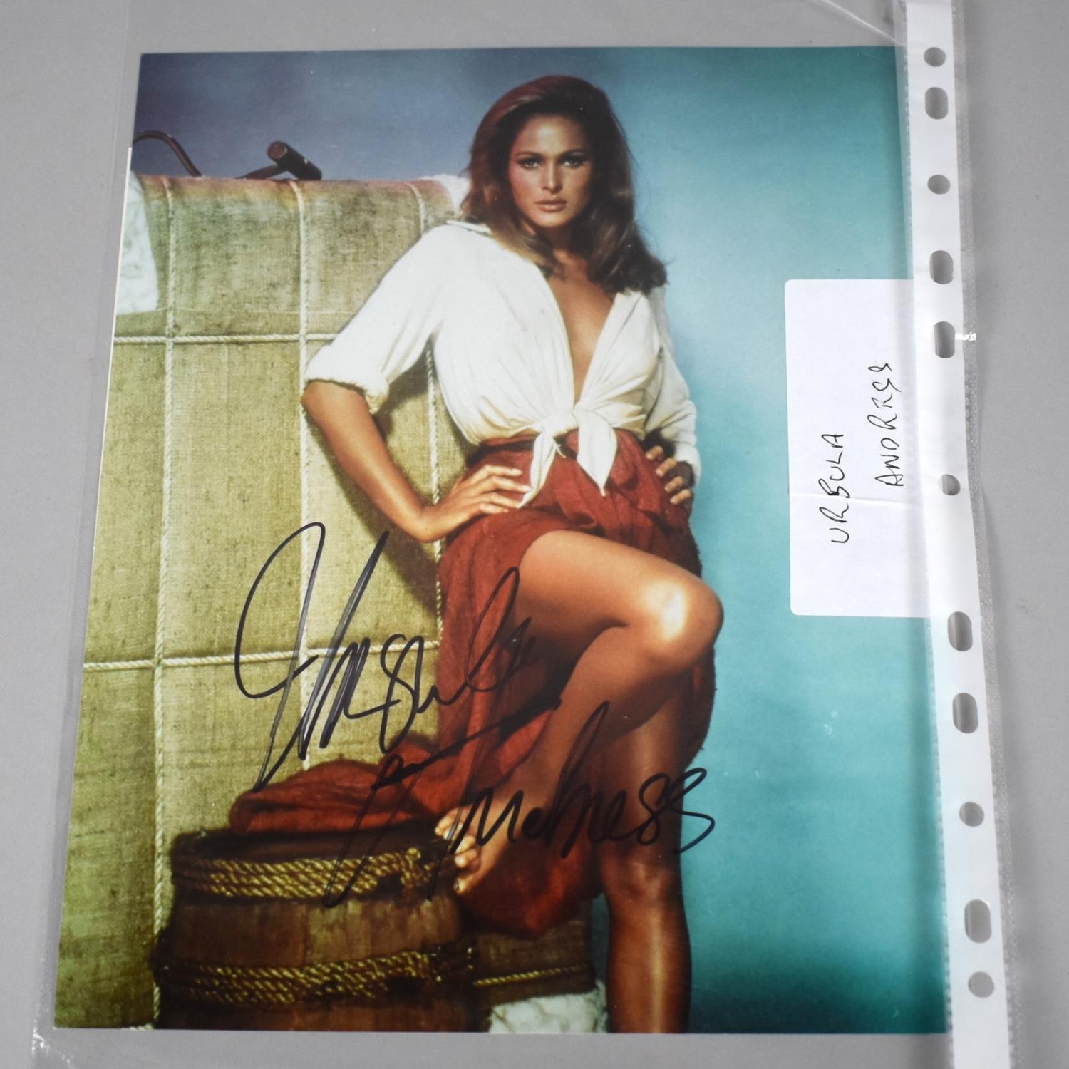 A Framed and Autographed Coloured Photo of Ursula Andress with Certificate of Authenticity