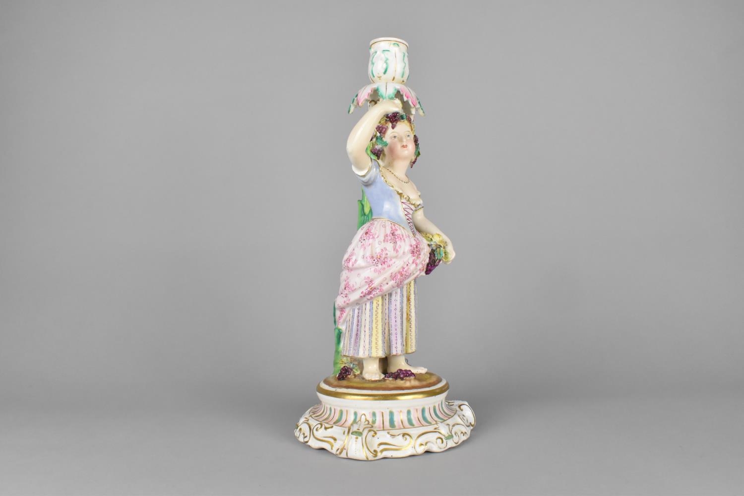A 19th Century German Porcelain Figural Candlestick Modelled as a Lady Holding Basket of Flowers and - Image 2 of 4