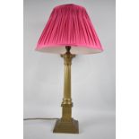A Brass Table Lamp in the From of a Reeded Corinthian Column on Stepped Square Base, Complete with
