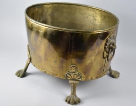 A Late 20th Century Oval Brass Coal/Log Bucket with Four Claw Feet and Lion Mask Ring Handles, 42.
