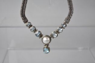 An Eastern Silver, Pearl and Topaz Style Blue Stone Necklace, 65.2gms