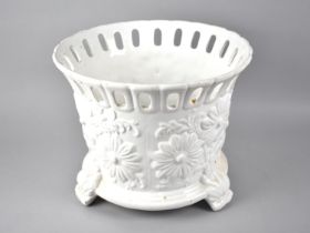 A Circular White Glazed Jardinière, The Relief Body Decorated with Flowers, Pierced Rim, 34cms