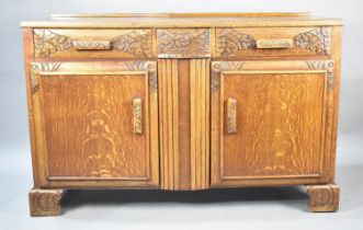 A Mid 20th Century Oak Sideboard with Base Cupboards Surmounted by Two Short Drawers, 134x45x87cms