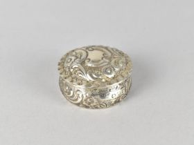 A Small Silver Box and Cover with Floral Repousse Decoration by Nathan & Hayes (George Nathan &