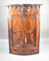 A Mid 19th Century Inlaid Mahogany Bow Fronted Wall Hanging Corner Cabinet with Panelled Doors and