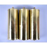 A Set of Three Brass Covered Cylindrical Clock Weights, 14cms High