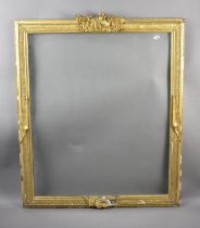 A Large Glazed Gilt Picture Frame with Military Mounts, Union Jacks Etc, 95x113cms Condition Issues