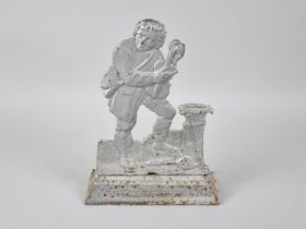 A 19th Century Fret Cut Cast Iron Doorstop in the From of a Minstrel, 26cms High