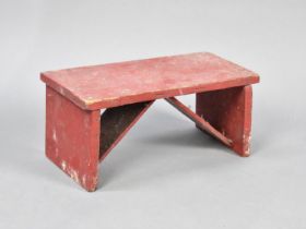 A Vintage Red Painted Rectangular Stool, 37cms Wide and 17cms High