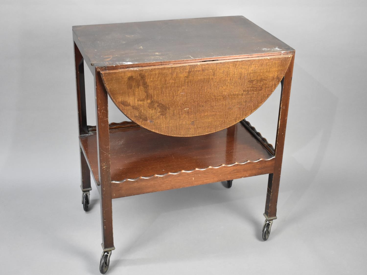 A Mid 20th Century Mahogany Drop Leaf Two Tier Trolley, 60cms Wide