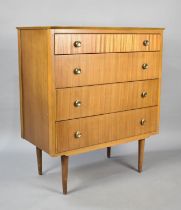 A Mid 20th Century Bedroom Four Drawer Chest, Raised on Tapering Supports. 79cms Wide