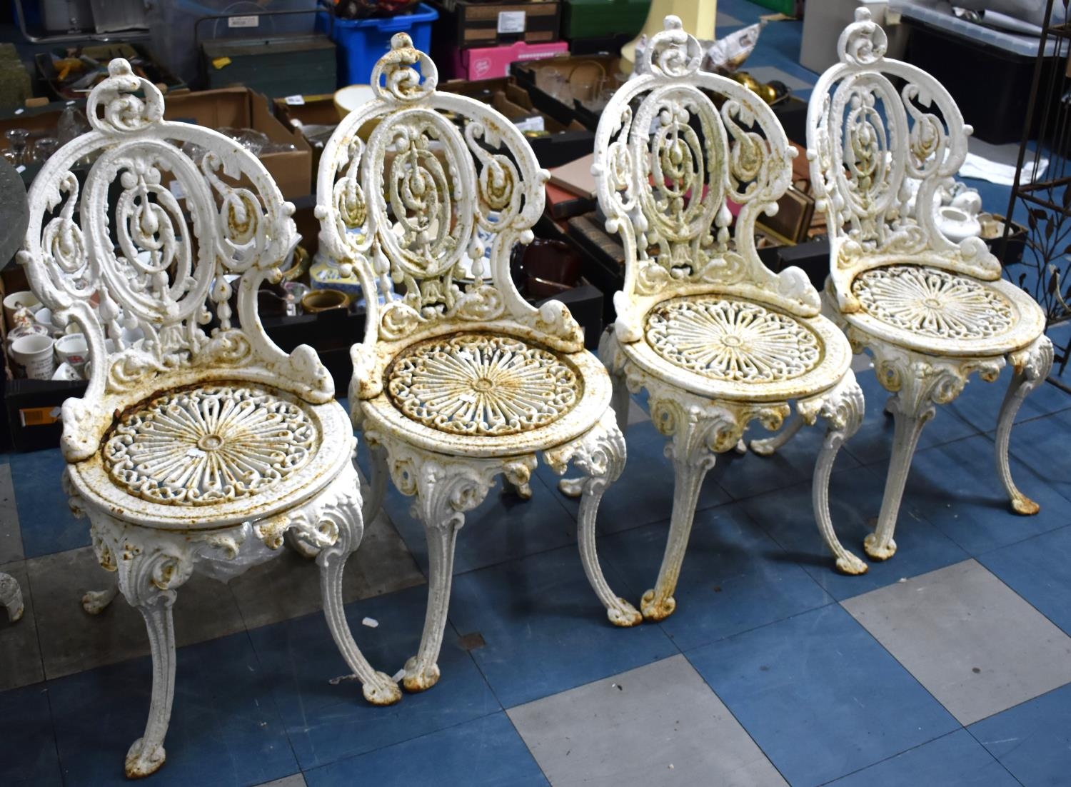 A Set of Four Victorian White Painted Coalbrookdale Style Garden Chairs