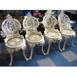 A Set of Four Victorian White Painted Coalbrookdale Style Garden Chairs
