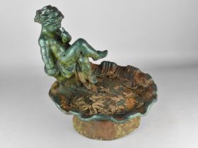 A Cast Metal Figural Bird Bath Modelled With Cherub Seated Upon Lily Pad on Short Circular Foot,