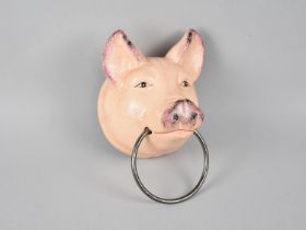A Modern Cast Iron Wall Mounting Towel Ring in the From of a Pigs Head, 17cms High plus VAT