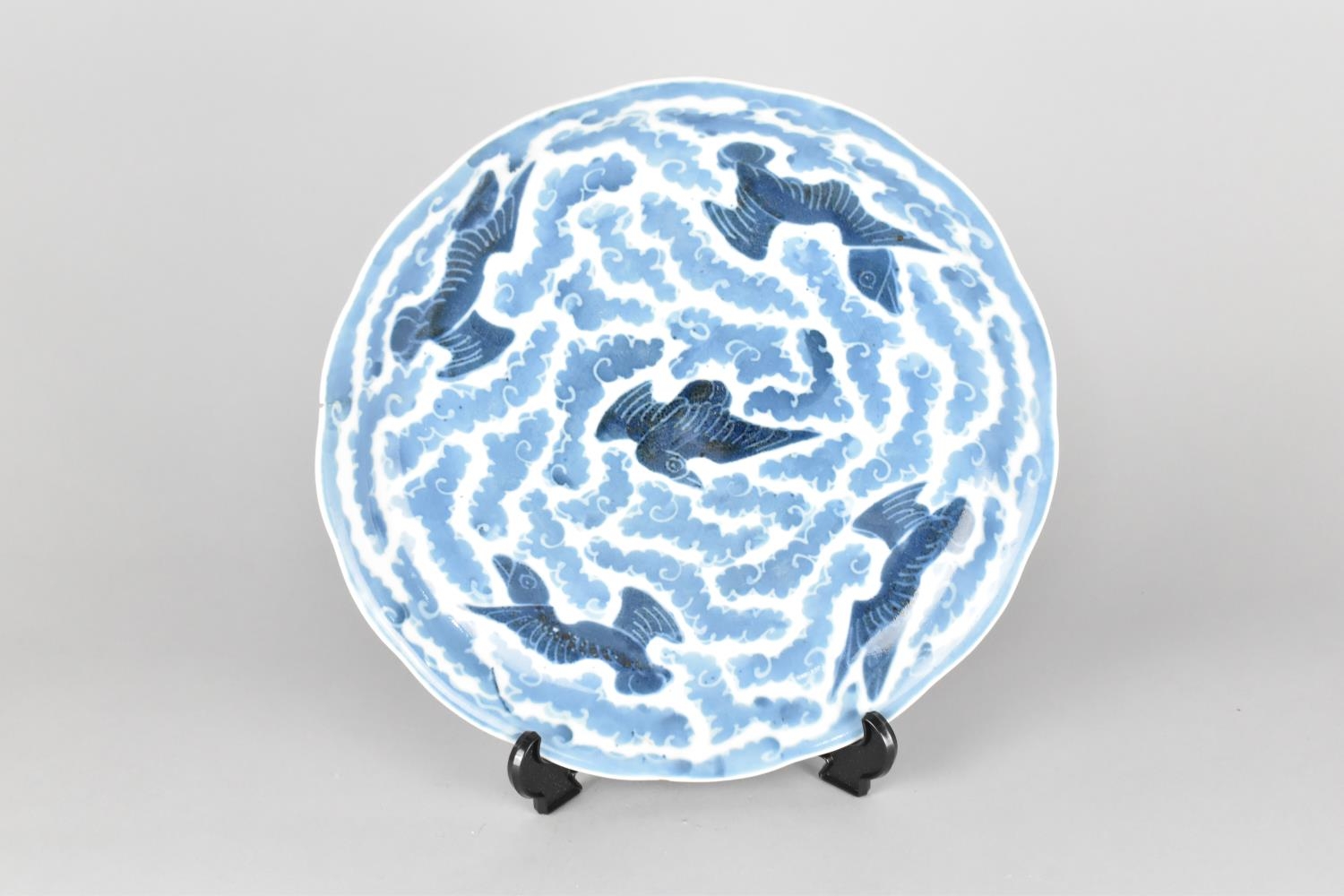 A Oriental Porcelain Blue and White Plate with Wavy Rim Decorated with Birds in Flight Amongst